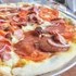Pizza Gourmet bacon, american pepperoni, cabano sausage, tomato & red onion