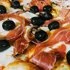 Pizza Gourmet prosciutto ham, cherry tomato, arugula & parmesan cheese